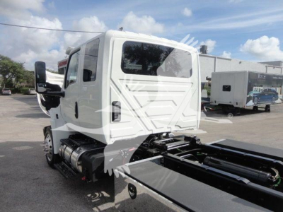 Truck cab and chassis with flatbed rollback undercarriage visible, International MV model, stock MV607EXCAB22XLP.