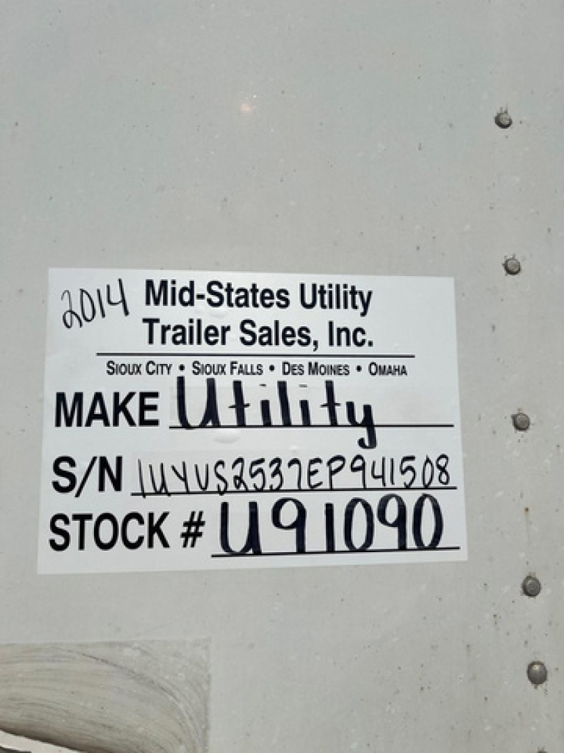 Sticker on side of trailer showing ‘2014 Mid-States Utility Trailer Sales, Inc.’ with Make Utility handwritten, S/N UYVS...941508 and STOCK # U91090.