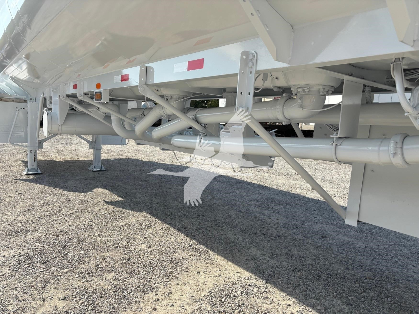 Trailer underside showing suspension and piping, Heil 9200Gal model, gasoline fuel trailer.