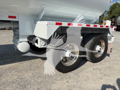 Trailer axle and wheel assembly of a 2019 Heil Dot406 utility trailer showing dual rear wheels and tire rims.