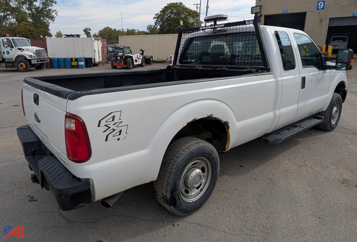 Ford F-250 Super Duty pickup truck rear-left view showing long bed and dual rear wheels, white color, 4x4 badge on side, rear bumper, utility tailgate