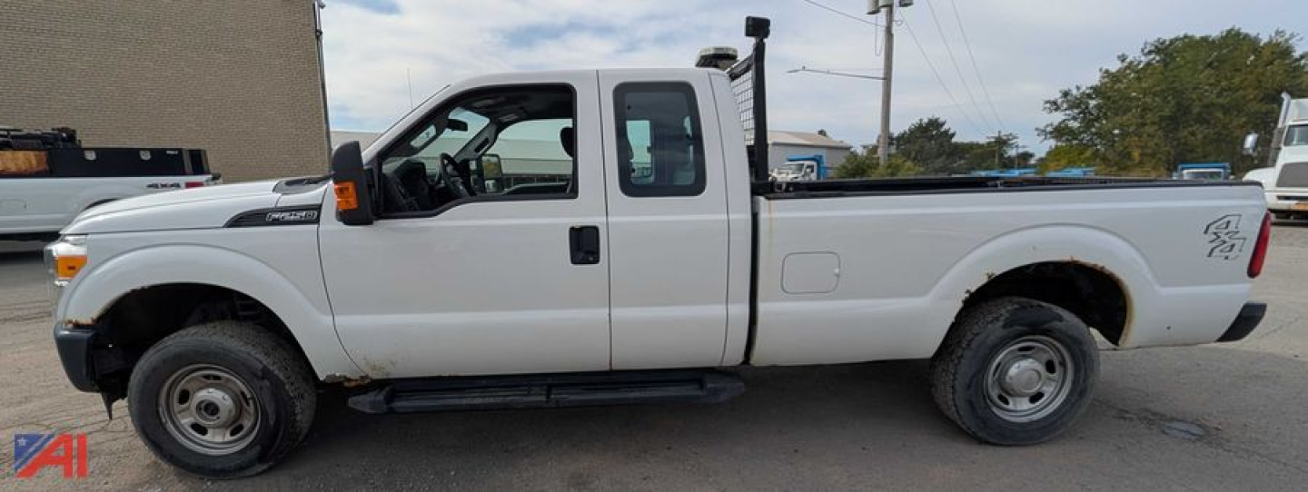 Ford F-250 Super Duty pickup with extended cab and dual rear wheels showing side profile.