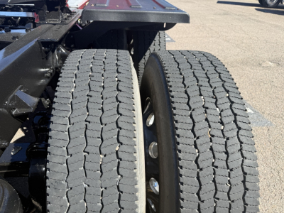 Kenworth T880 chassis with dual rear tires and visible wheel hubs; heavy-duty truck frame and suspension components captured; no specific text visible on badges.