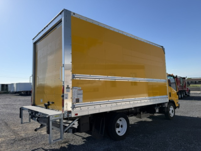 Box truck side view showing yellow cargo box on Isuzu NPR with rear underride guard and standard cab.