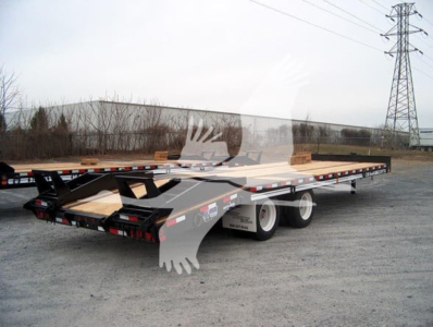 Flatbed trailer with low-profile deck showing dual rear axles and ramp equipment, labeled with TL088373 stock number and VIN in the background.