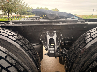 Kenworth T680 chassis framing showing rear suspension and fifth wheel mounting point with dual rear wheels.