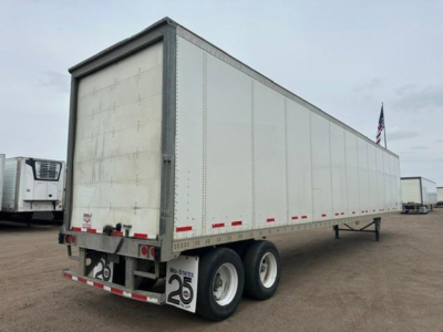 Trailer rear and side view showing a white 2016 Wabash van semi-trailer with dual rear axles and mud flaps, stock U90906, VIN 1JJV532D2GL908636.