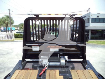 Kenworth T880 rollback bed with hydraulic winch and open cab back, view of rear with tailgate and hoist. Visible labels include 'Jerr-Dan' on the back panel.