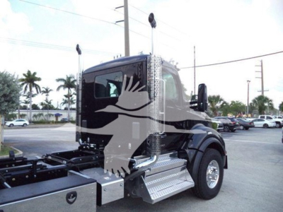 Kenworth T880 rollback truck cab with side steps and frame visible, no visible text on labels in image.