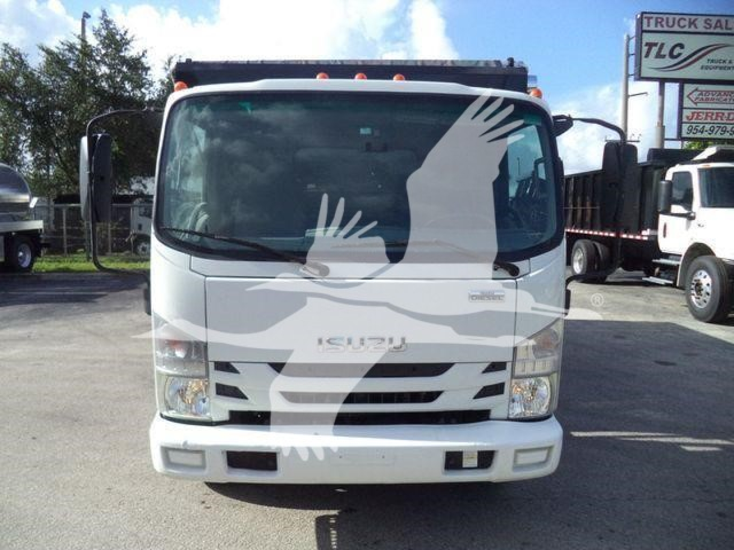 Isuzu NPR/NRR cab forward truck front view showing windshield, grille, headlights; no visible text other than brand emblem.