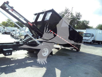 Isuzu NPRR 2021 roll-off truck bed in raised position with hydraulic lifting mechanism and dump bed, side view showing black container and trailer hitch.