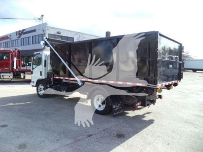 Isuzu NPRR roll-off truck showing side panel and rear, two-tone black dump body, white cab, reflective tape.