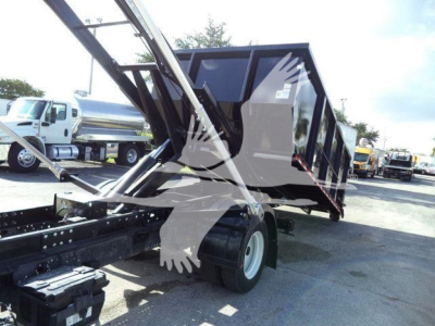 Isuzu NPRR roll-off truck body and chassis with hydraulic arm raising a dump bed, side view showing wheels and frame.