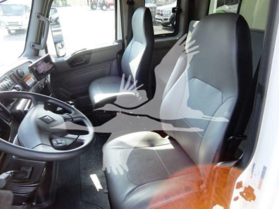 Interior cab view of a 2022 International MV truck showing steering wheel, driver and passenger seats, dashboard, and center console.