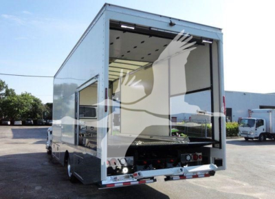 Truck back view of 2022 International MV rollback truck body showing open rear loading ramp and cargo area.