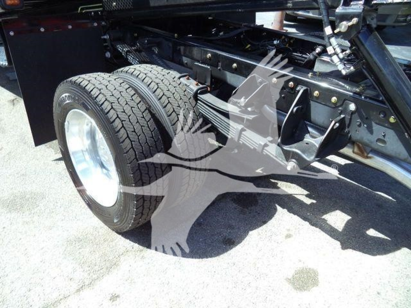 Ram 5500 truck chassis with dual rear wheels and suspension components visible.
