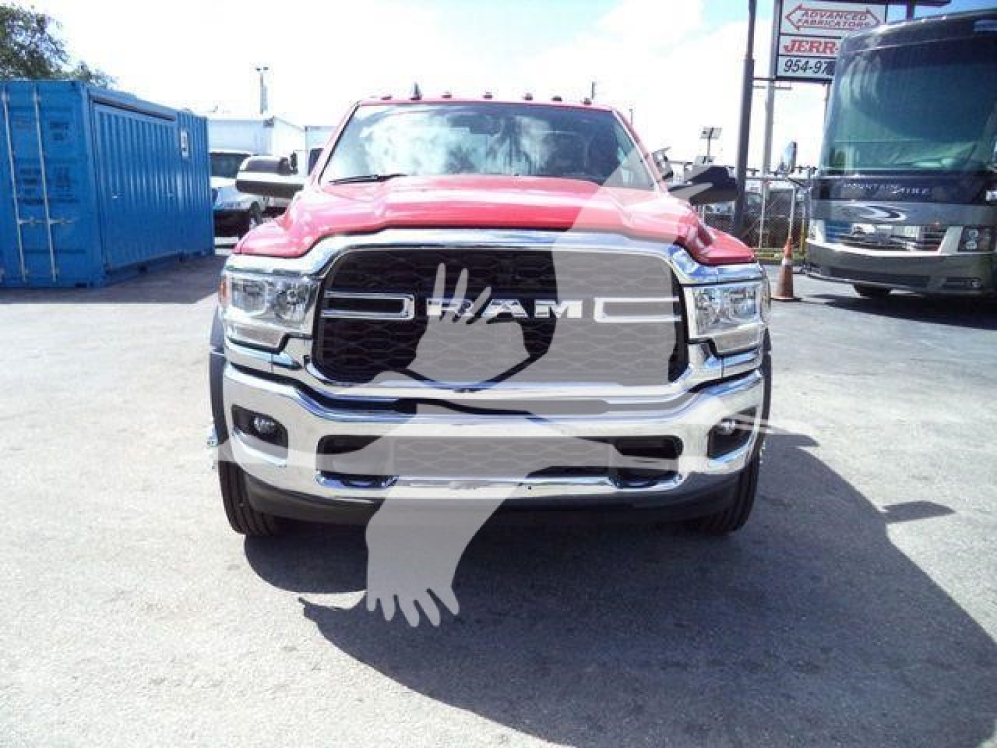Ram 5500 pickup front view showing chrome grille and headlights with RAM logo prominent.