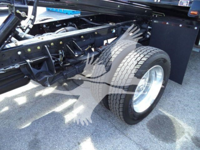 Ram 5500 chassis and front wheel showing suspension and frame components.