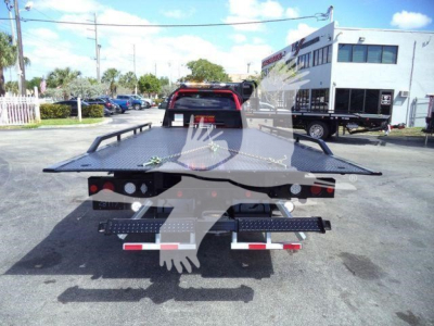 Ram 5500 SLT rollback truck bed from rear view showing flatbed and taillights.