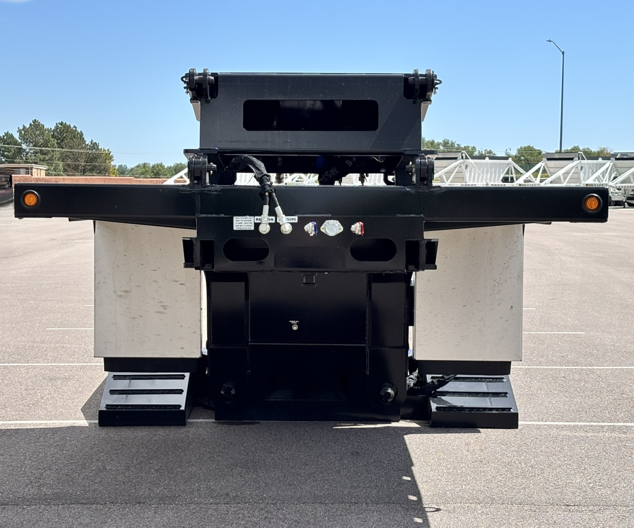 Front view of a new Alpha A80 HDGC-E 48' lowboy trailer with hydraulic detach double drop extendable. Features include black frame, rear support, metal panels, and reflectors.