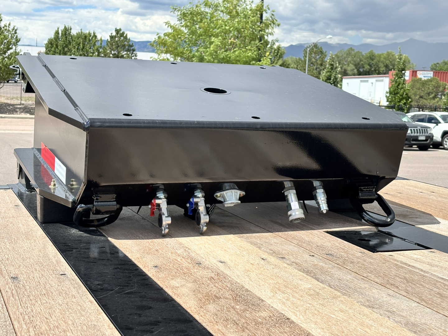 HDGC-E 48' lowboy trailer top view showing hydraulic detatch dual drop extendable components and multiple connection ports on the front edge.
