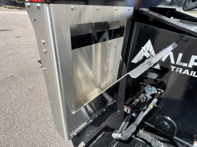 HDGC-E 48' lowboy trailer photo showing a metal toolbox/compartment with riveted aluminum skin and hydraulic hoses near the hitch area.