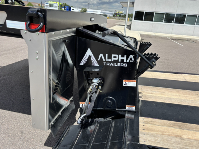 Alpha Trailers A80 HDGC-E lowboy trailer hitch unit with hydraulic detach and double drop extendable feature in black with stacked wood deck and safety chains visible.