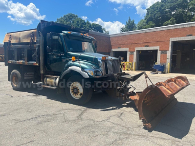 International 7400 dump truck with attached snowplow blade in front, truck cab green, dumping bed, stock number 20518-369, VIN 1HTWDAAR37J526826, used condition.