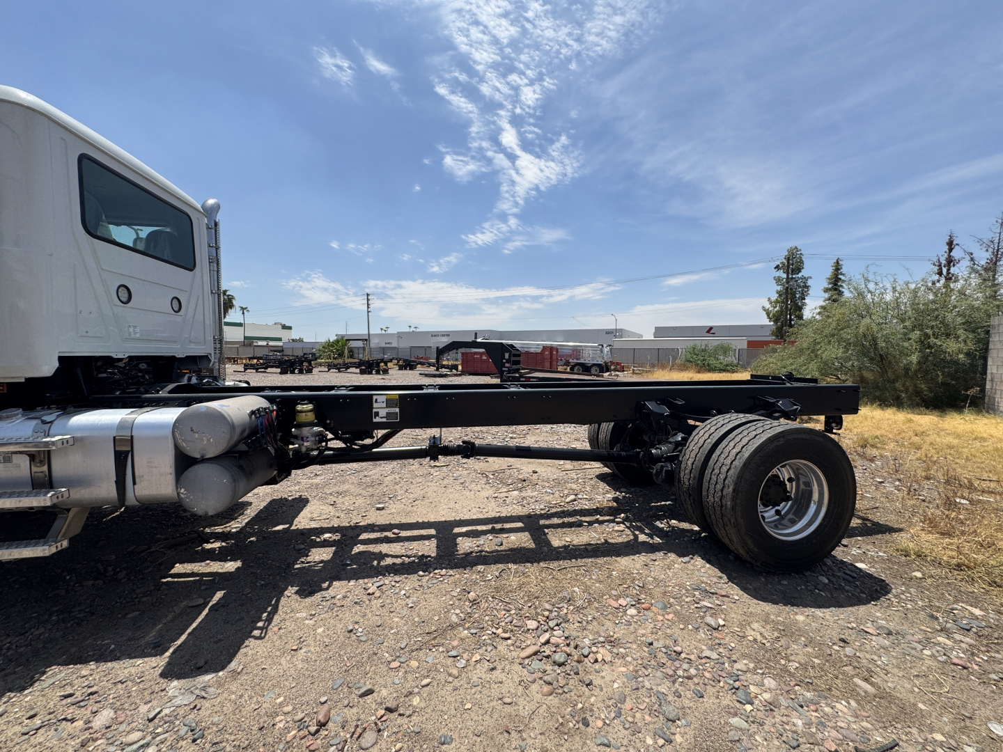 Mack GR44B cab and chassis side view showing frame rails, single rear axle, fuel tank, and wheel tires.