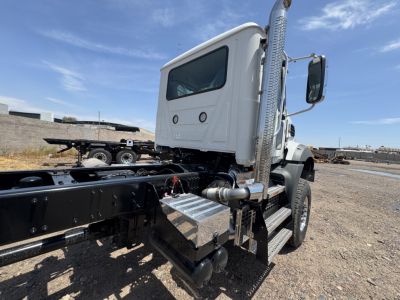 Mack GR44B cab and chassis showing side step, fuel tank, and exhaust with chrome finish.