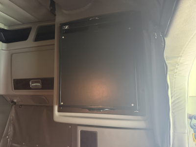 Peterbilt 389 sleeper cab interior with a mounted flat-screen monitor or control panel inside the cab.