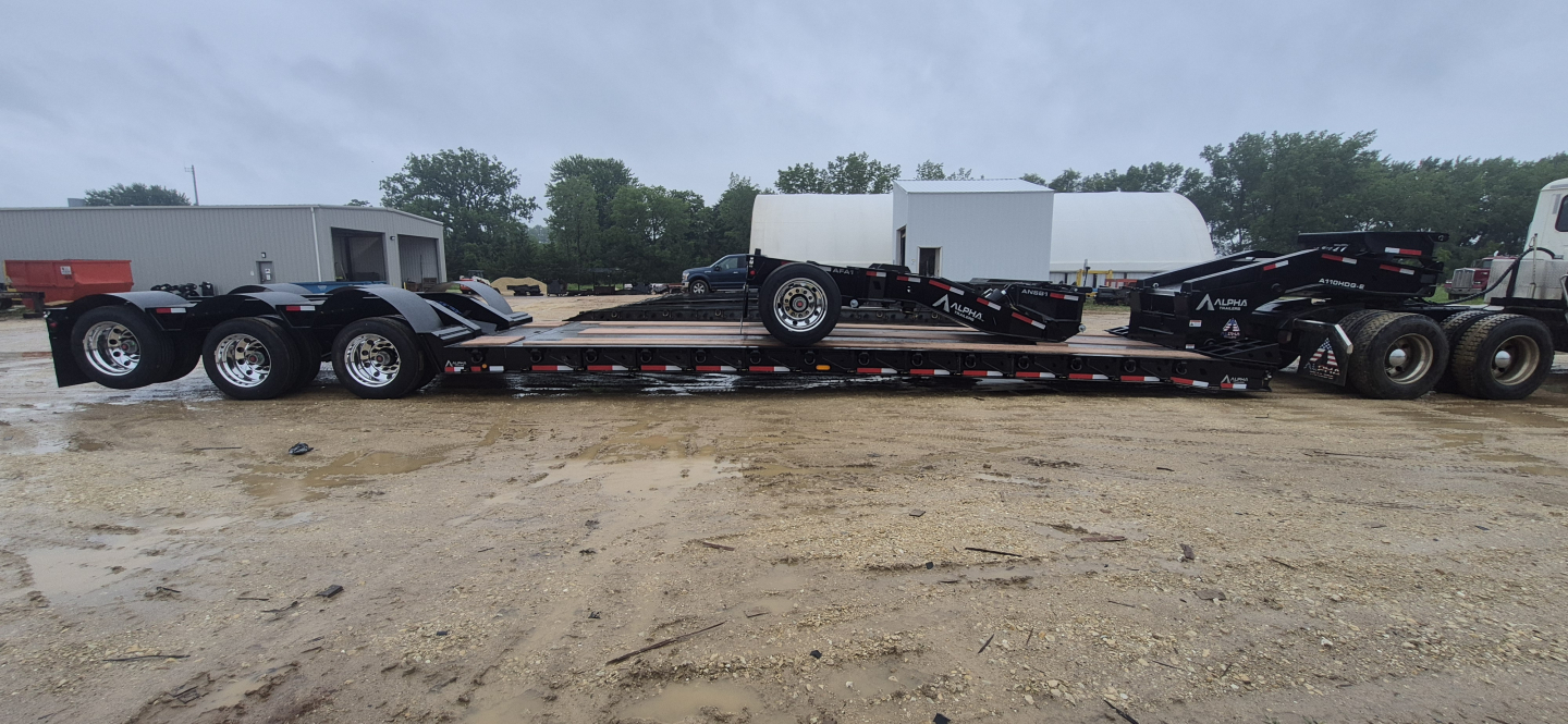 Trailer chassis of a 2027 Alpha A110HDG-E hyd detachable extendable lowboy trailer with multiple axles and a detachable gooseneck.