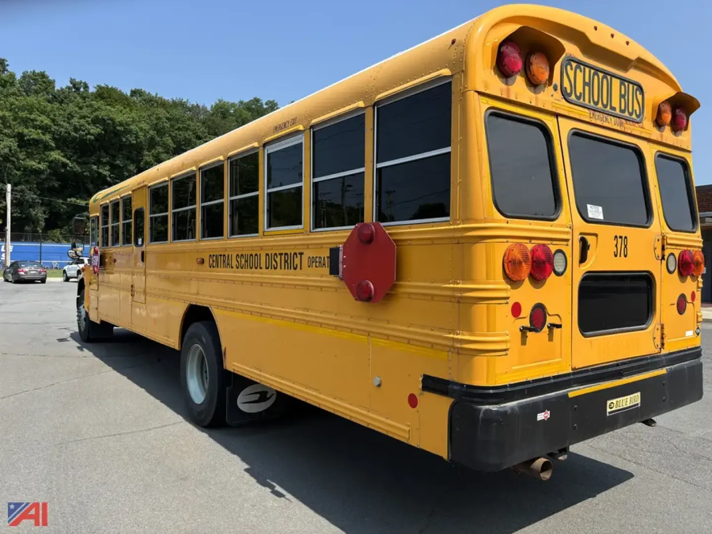 Yellow school bus with Central School District lettering, rear view showing bus doors and tail lights.