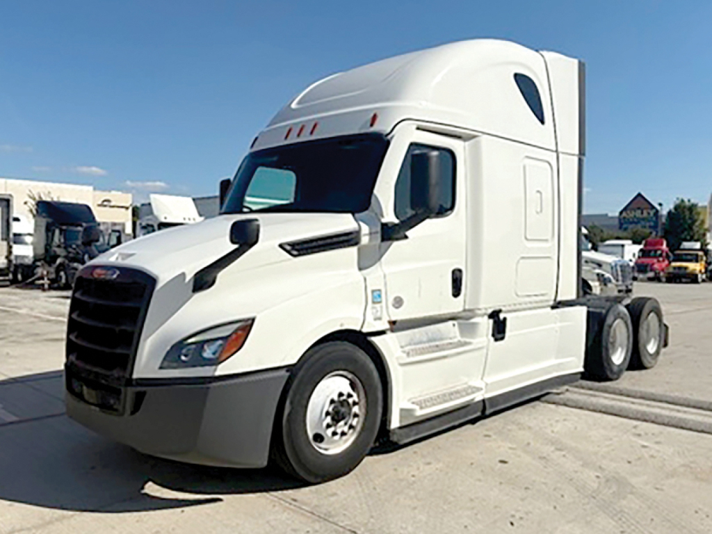 Freightliner Cascadia126 tractor drivetrain cab side view with white paint, decal-less, fuel tanks, and wheels visible.