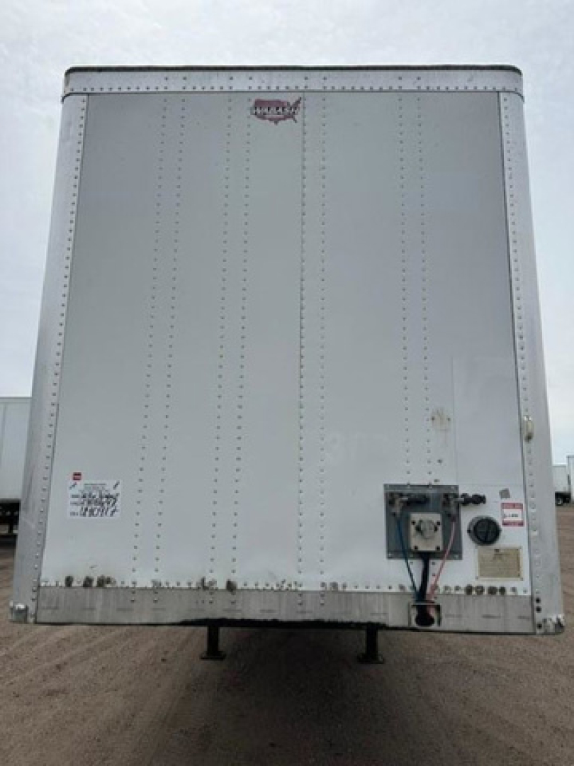 Rear view of a 2016 Wabash van trailer showing electrical panel and hitch connections.
