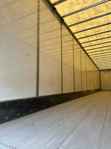 Trailer interior showing empty cargo area with ribbed sidewalls