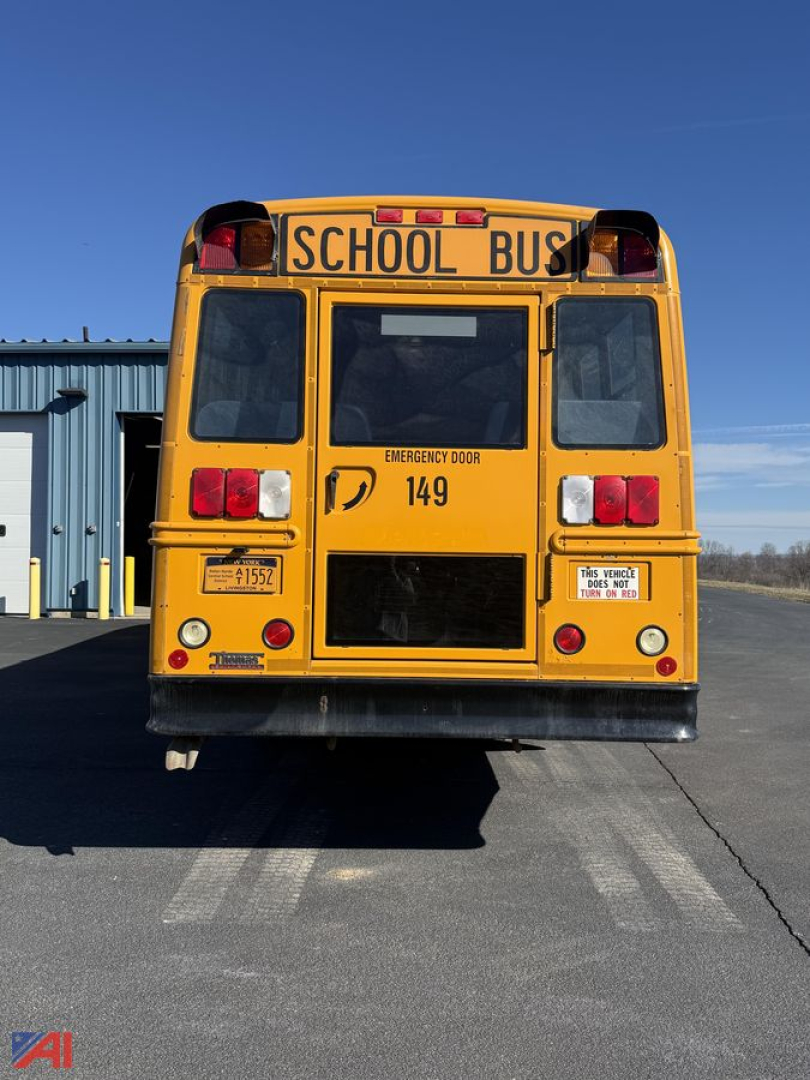 Rear view of a yellow school bus with 'SCHOOL BUS' sign, emergency exit door, tail lights, and number 149.