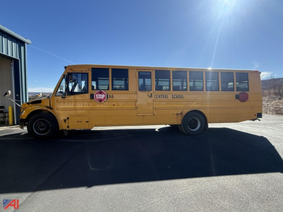 School bus side view showing Central School lettering, stop sign, and bus number 149 on a yellow Freightliner Thomas body in-service.