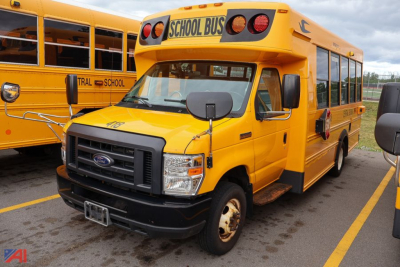 Ford - 2019 Blue Bird E-Series school bus in yellow with black bumper and 'SCHOOL BUS' sign on top, side view showing fleet doors and windows.