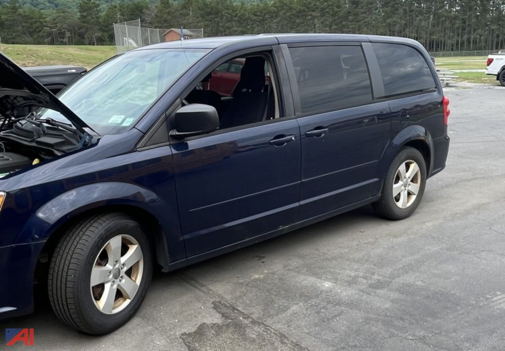 Minivan: 2013 Dodge Grand Caravan with hood open showing passenger side, blue exterior, black windows, silver wheels.