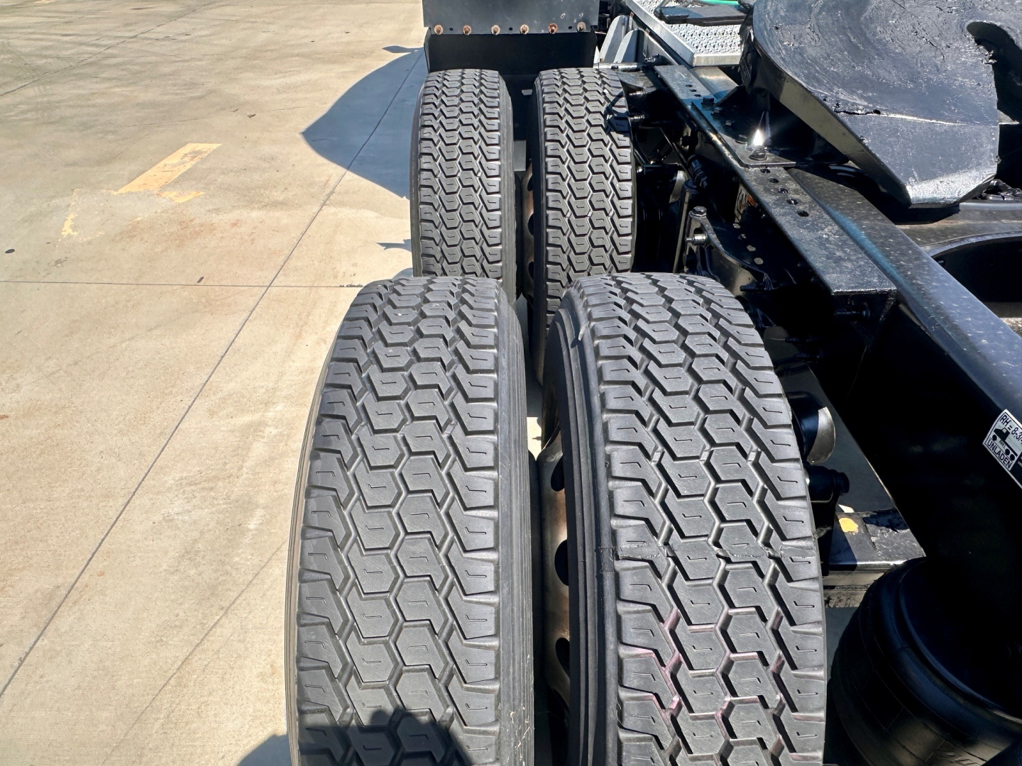 Dual rear axles visible with treaded truck tires on a Peterbilt 579 chassis.