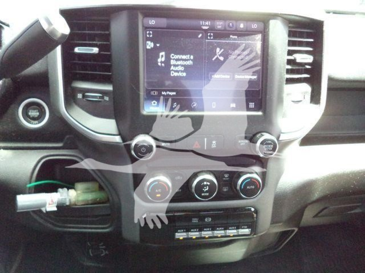 Ram 5500 dash and center console showing touchscreen infotainment system and climate controls.