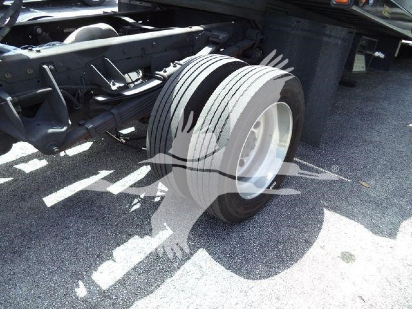 Truck frame and front wheel showing chassis and tire from a Ram 5500 rollback classified image.