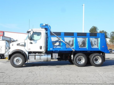 Western Star 47X dump truck side view showing blue dump body and white cab