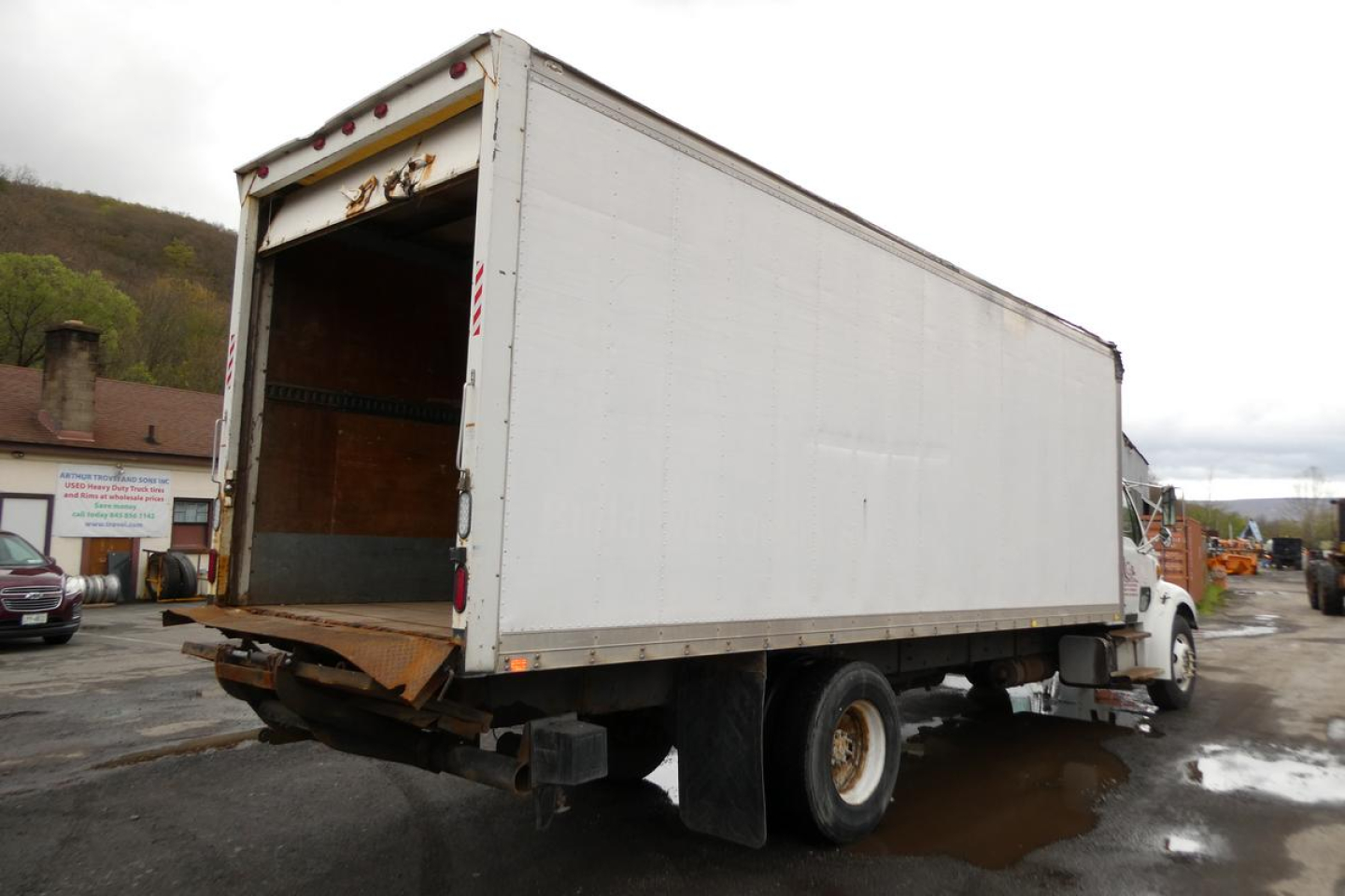 Sterling ACTERRA box truck rear view showing cargo area with open rear doors and dual rear wheels.