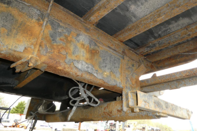 Sterling Acterra heavy truck undercarriage showing rusted frame and hitch receiver with exposed wiring harness.