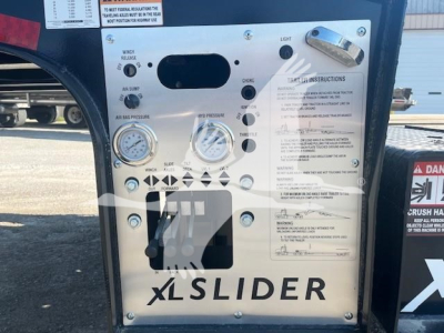 XL Specialized trailer control panel with gauges and switches showing warning labels and the word XLSLIDER