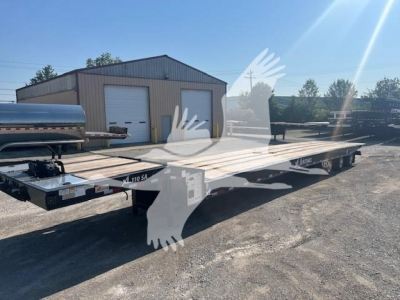 XL Specialized 110Sa traveling trailer showing open flatbed and dual tandem axles.