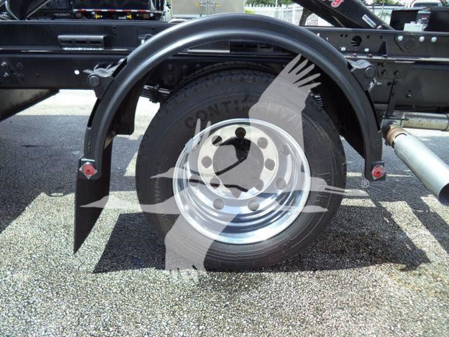 Wheel and hitch area of a 2023 Chevrolet Silverado 6500HD chassis showing spare tire and frame components.