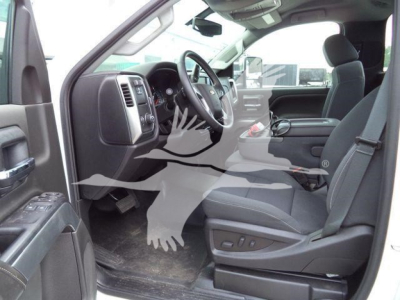 Chevrolet Silverado 6500HD interior view showing front seats steering wheel dashboard and center console.